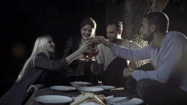 Friends smile and enjoy aperitif outdoor  slow motion  