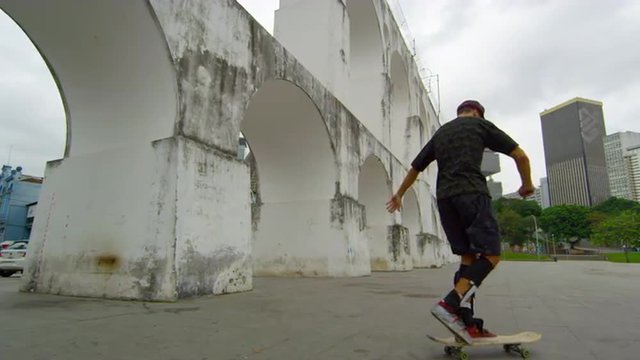 RIO DE JANEIRO, BRAZIL - JUNE 23: Slow dolly shot of skateboarder spins on Jun 23, 2013 in Rio