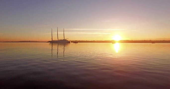 aerial view sailing yacht in the sunrise
