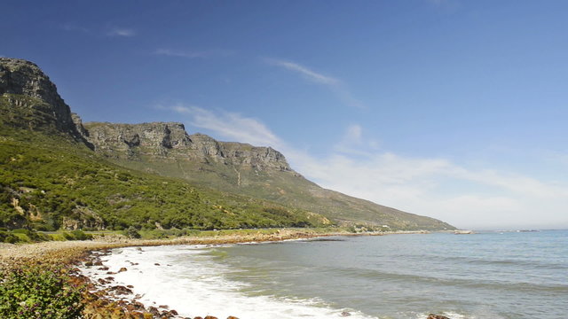 Scenic view along the coastal road at the back of famous Table Mountain and the 12 Apostles in Cape Town, South Africa, in high definition footage