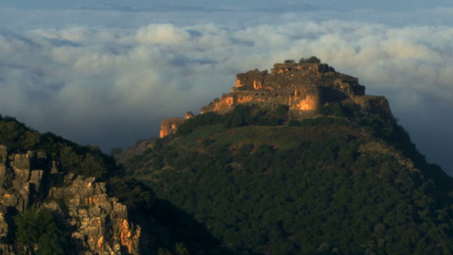 Stock Video Footage of Nimrod Fortress above a cloudy valley shot in Israel at 4k with Red.