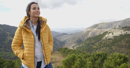 Smiling woman appreciating the peace of nature