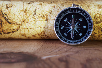 Compass on vintage map. Retro style.