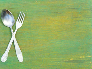 Fork and spoon on old wood