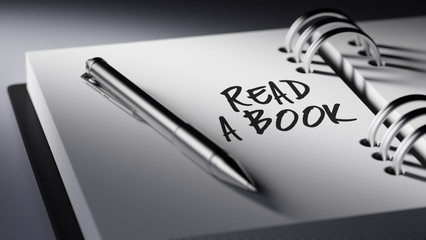 Closeup of a personal agenda setting an important date writing w