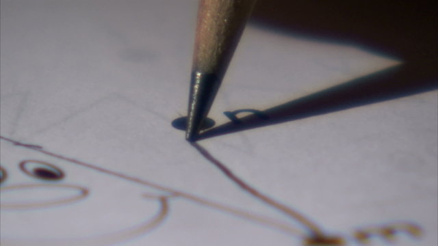 Extreme close up of a pencil connecting dots.