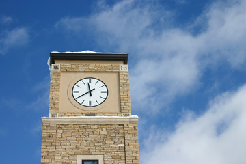 Clock tower in blue sky clouds
