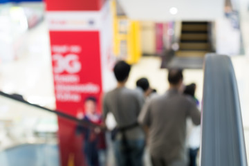 abstract blur people  moving escalator motion in a shopping mall