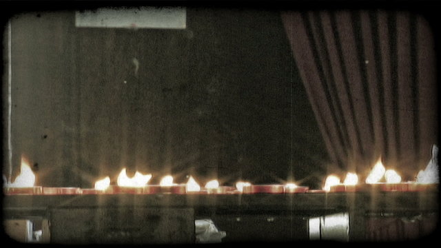 Candles on Alter 2. Vintage stylized video clip.