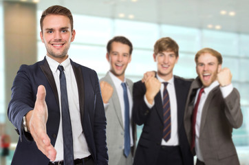 Young caucasian businessmen with success gesture
