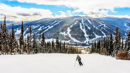 Foto op Plexiglas Skiing down to the village of Sun Peaks in the Shuswap Highlands of central British Columbia, Canada © hpbfotos