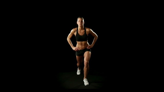 Young athletic woman wearing sporstwear is exercising  slow motion  