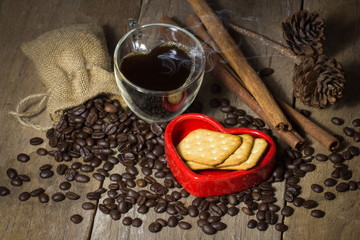 Heart shape cup, Bread in Red Heart and Coffee beans on wooden a