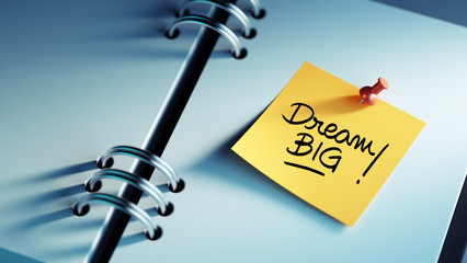 Closeup Yellow Sticky Note paste it in a notebook setting an app