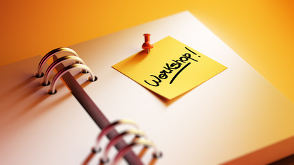 Closeup Yellow Sticky Note paste it in a notebook setting an app