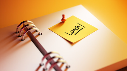 Closeup Yellow Sticky Note paste it in a notebook setting an app