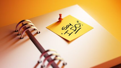 Closeup Yellow Sticky Note paste it in a notebook setting an app