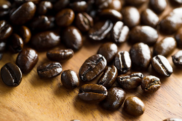 Roasted coffee bean on grunge wood table