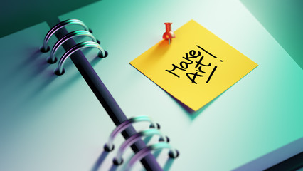 Closeup Yellow Sticky Note paste it in a notebook setting an app