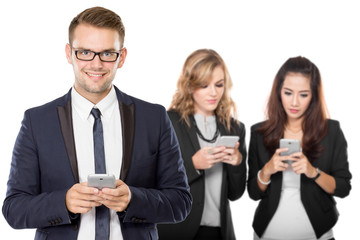 Young caucasian businessman with his team behind holding cellpho