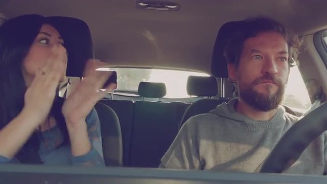 Beautiful woman yelling to boyfriend driving car 4K