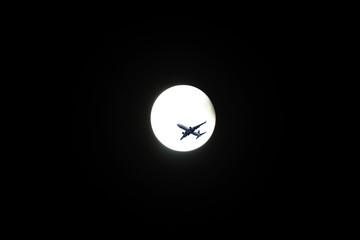 Moon,the plane flying