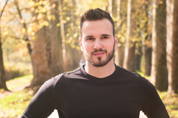 Runner man portrait in autumn park