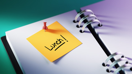 Closeup Yellow Sticky Note paste it in a notebook setting an app