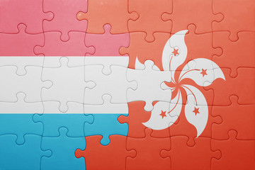 puzzle with the national flag of luxembourg and hong kong