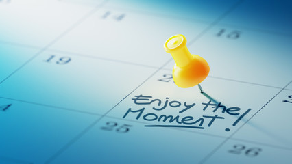 Concept image of a Calendar with a yellow push pin. Closeup shot