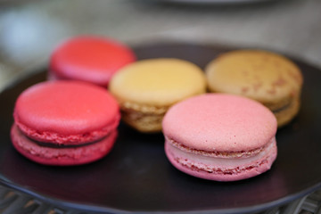 colorful macaron on plate close up shot