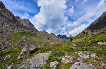 Woman tourist on a background of mountain tundra