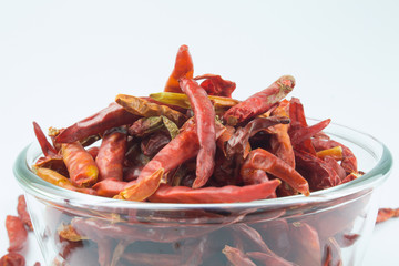 Dried red chilli peppers in a bowl