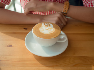 Coffee cup and woman.