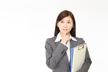 秘密のジェスチャーをする女性