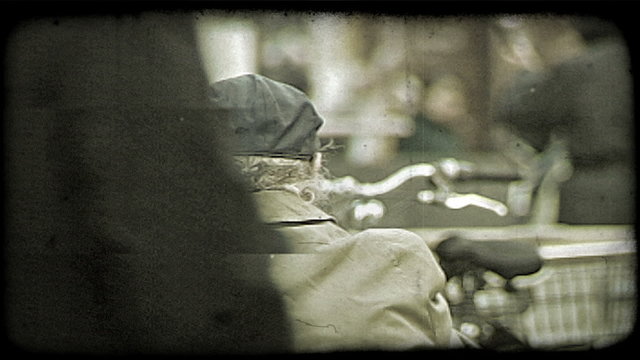 Woman feeds pidgeons. Vintage stylized video clip.