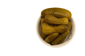 Pickled gherkins in a small white plate
