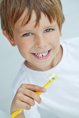 Happy boy are cleaning teeth 