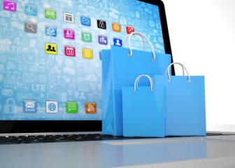 laptop and  shopping pags on white background