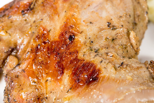 Closeup of grilled chocken leg.