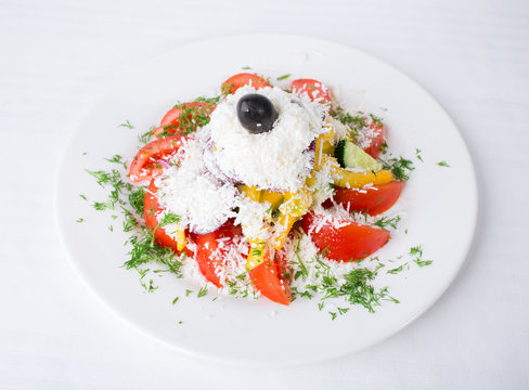 Delicious vegetable salad with grated cheese.