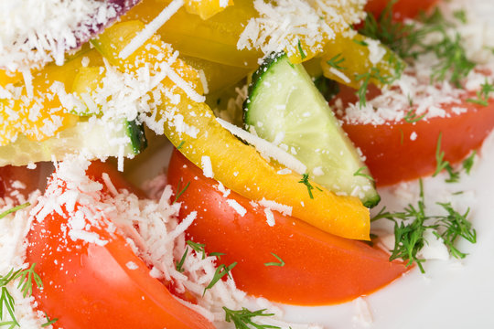 Delicious vegetable salad with grated cheese. 