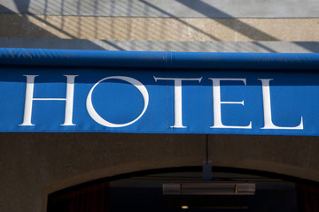 Blue and White Hotel Sign