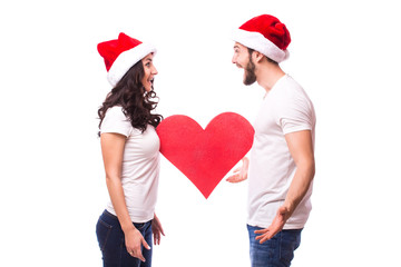 Romantic Young Happy Couple hugging and big red heart isolated on white background