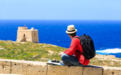 young man travel looking at scenic view