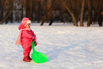 cute little toddler girl play in winter