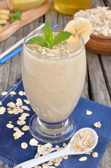 Fresh made Banana smoothie on wooden background