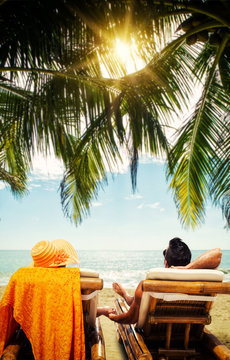Couple on the beach at tropical resort Travel concept