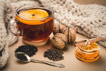 Cup of winter tea with orange and spices