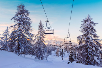 Winter mountains panorama with ski slopes and ski lifts - 99925723